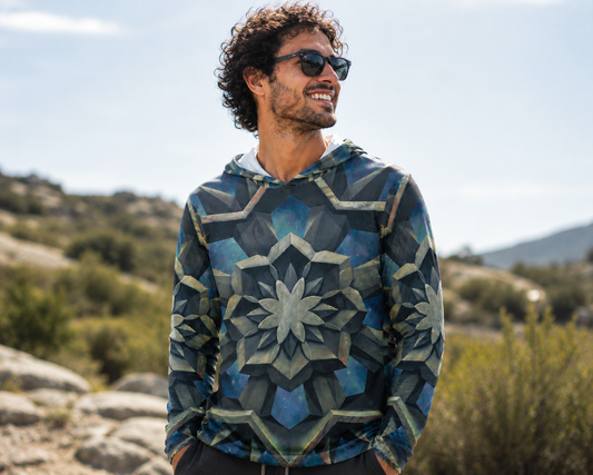 Man wearing UV hoodie with "dissolve" painting printed all over entire hoodie